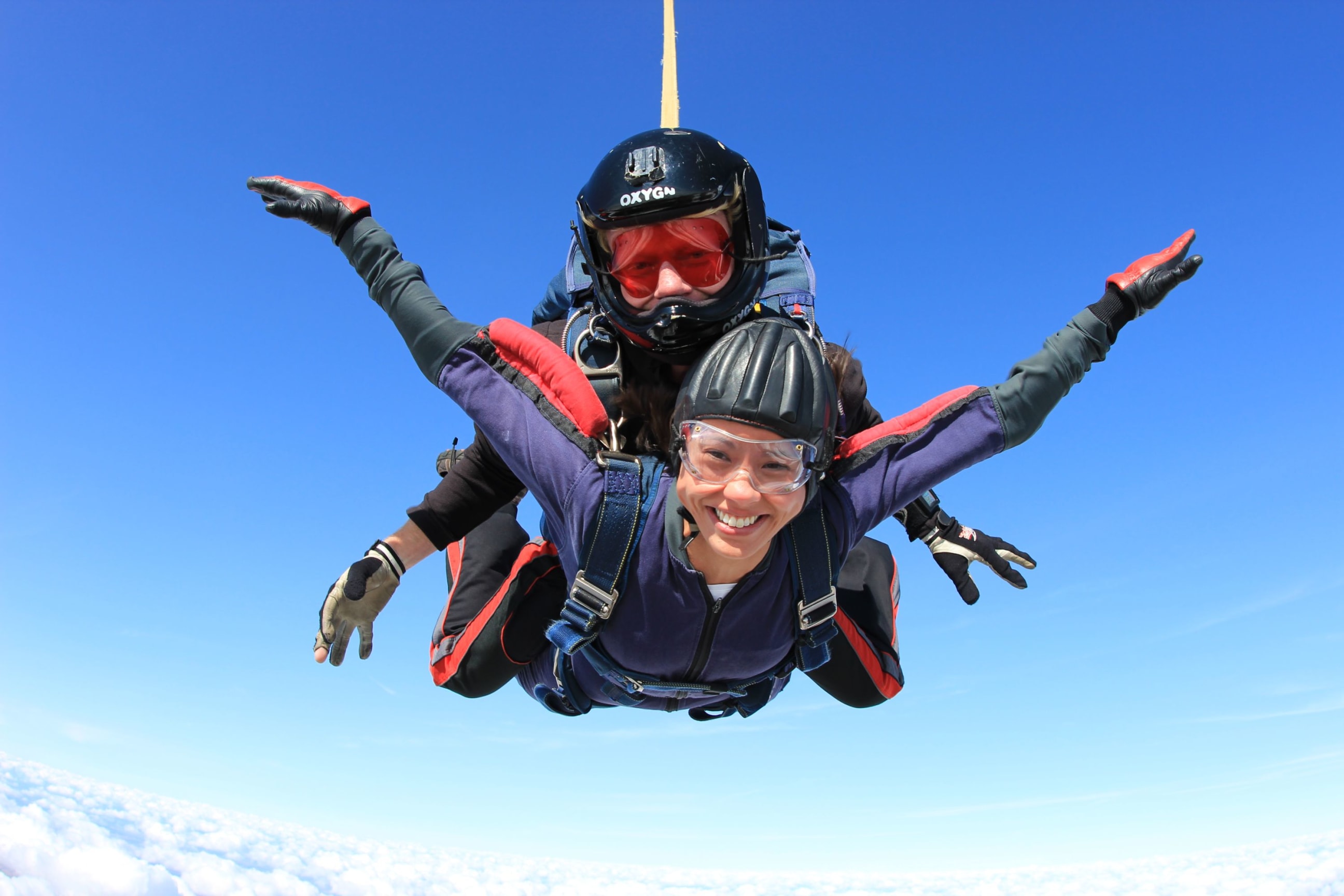 Blue sky with sky divers