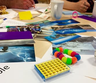 Beads and craft materials on a table Beads and craft materials on a table